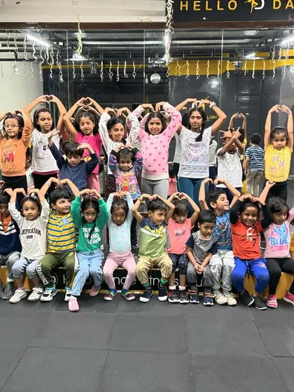 Our little "rainbow" of dancers making heart shapes. We love doing themed photoshoots that are both fun for the kids and create beautiful memories.