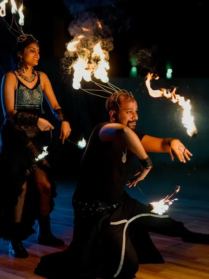 A team of professional fire dancers performing at a reception. This kind of unique entertainment provides a "wow" factor that guests will talk about for years to come.