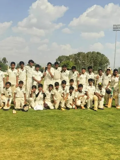 The U-12 boys' team poses for a photo on a sunny day.