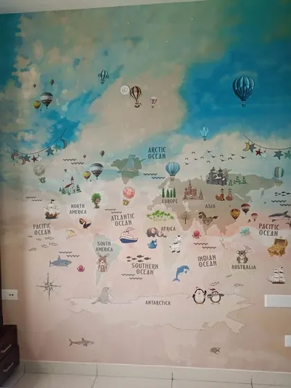 A large world map mural with hot air balloons and clouds, sparking a sense of adventure.
