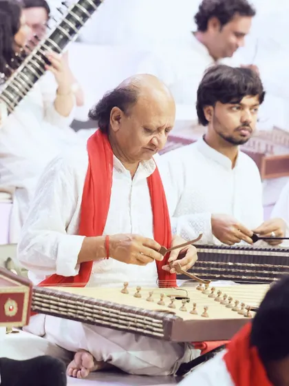 A musician plays the santoor as part of a classical ensemble. We coordinate with various artist groups to provide soulful and appropriate entertainment for religious and corporate events.