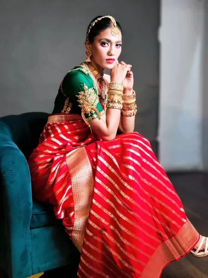 A traditional South Indian bridal hairstyle with a sleek bun and a gold matha patti. This look is timeless and showcases my expertise in regional bridal styles.