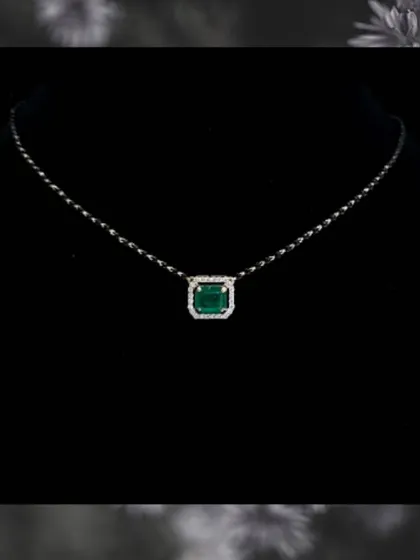 A duplicate image of the emerald gemstone mangalsutra. This piece is a perfect example of how we incorporate personal style into traditional jewellery.