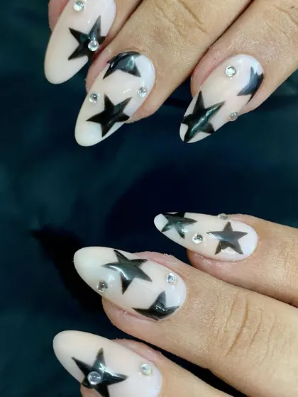 Another angle of the edgy black star and rhinestone nail art.