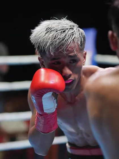 No fear, just fire. A tight close-up of Zoramchanna in the ring, eyes locked on his opponent, ready to trade.