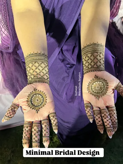 A minimal bridal design that is both modern and elegant. This pattern features a central mandala on the palm with a matching cuff and finger details.