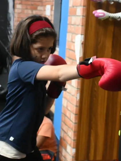Another shot of our young student throwing a punch. We provide the knowledge and training they need to succeed.