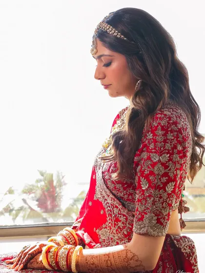 A moment of reflection. This shot beautifully captures the detailed embroidery of her blouse and the soft, blended eyeshadow I applied for a romantic feel.