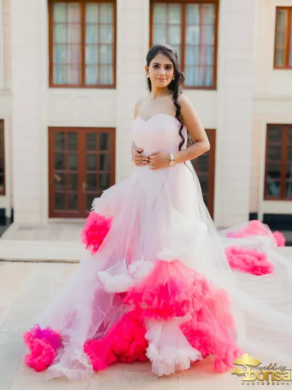 A portrait of the bride on the terrace, with her colorful gown spread out, creating a beautiful and vibrant image.