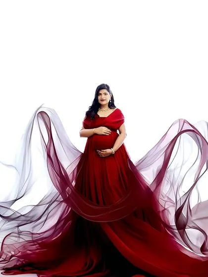 This image showcases our creative fabric and digital editing work. The flowing red gown is enhanced with ethereal wisps of fabric for a magical, artistic effect.