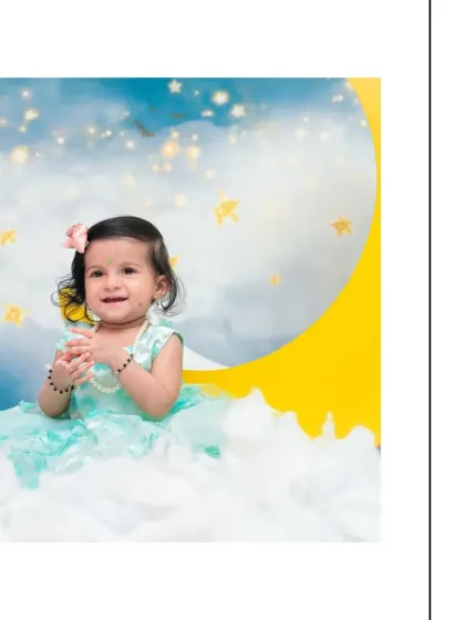 A sweet, gentle smile captured during a celestial-themed session. The soft focus on the background stars makes the baby the complete focus of this beautiful portrait.