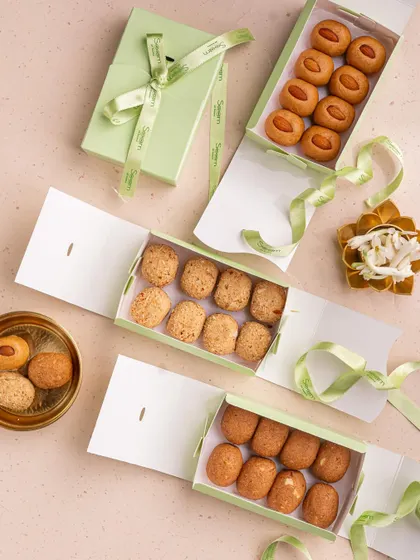 My laddoos feel like a warm hug. Here are three different varieties of my traditional laddoos, unboxed and ready to be shared, each made just the way nani used to.