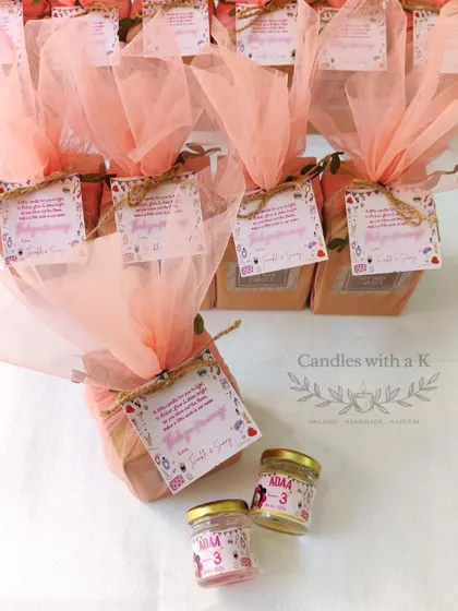 The full order of spa-themed birthday favors, beautifully wrapped in pink net.