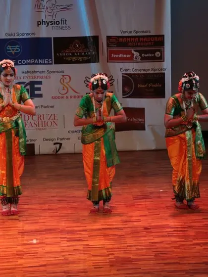 A respectful 'Namaste' pose concluding their beautiful Kuchipudi performance.