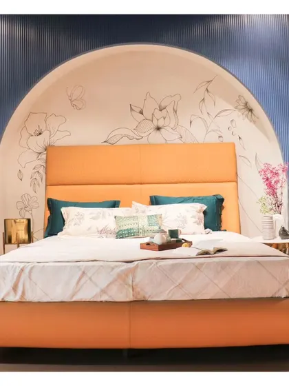 The full view of the Winston bed, set against an arched niche with a hand-drawn floral mural, creating a stunning backdrop.