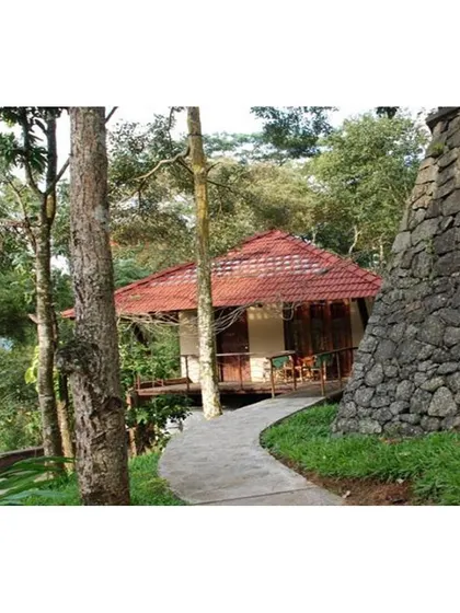 This cottage in Elan Hill, Kerala, is a testament to working with the land. We designed the structure to sit lightly on the terrain, following its natural contours and preserving the indomitable spirit of the landscape.