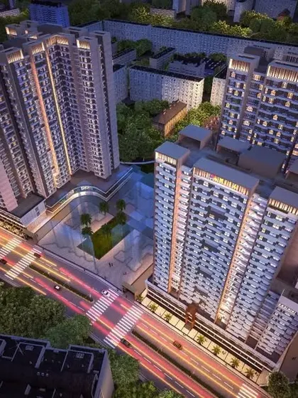 This aerial night render showcases our design for Vikas Ritz in Kalyan. The lighting strategy emphasizes the building's form and highlights the bustling energy of the commercial podium at its base, integrating it with the urban fabric.