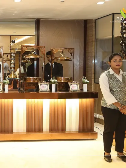 Another shot of our professional service staff, ensuring the 'Roti' station is perfectly managed and guests are served efficiently.