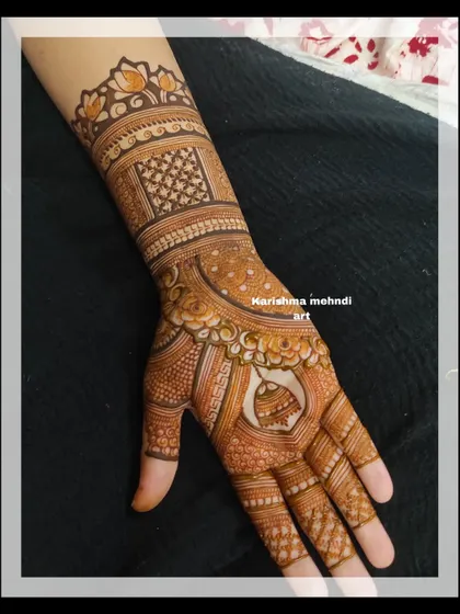 A classic and elegant design for a guest, featuring a central mandala on the palm. The wrist is adorned with a lotus cuff and traditional patterns, creating a balanced and beautiful look.