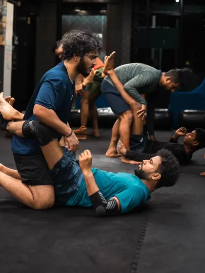Students pair up to practice guard passing drills, a key part of our Jiu-Jitsu curriculum.