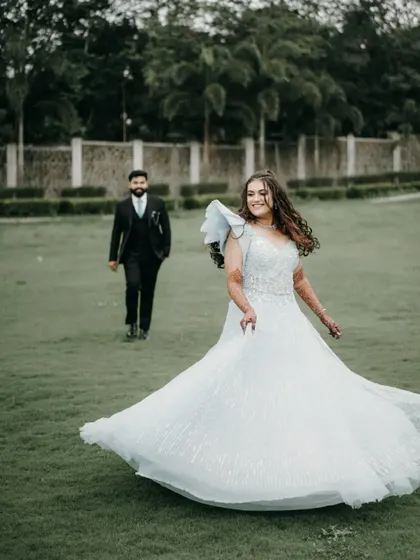 A playful and beautiful shot of her twirling in her engagement gown. It captures her joy and the elegance of the dress perfectly.