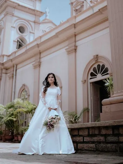A beautiful Christian bride standing outside the church, ready to walk down the aisle. I focus on capturing the elegance and anticipation of this pivotal moment.
