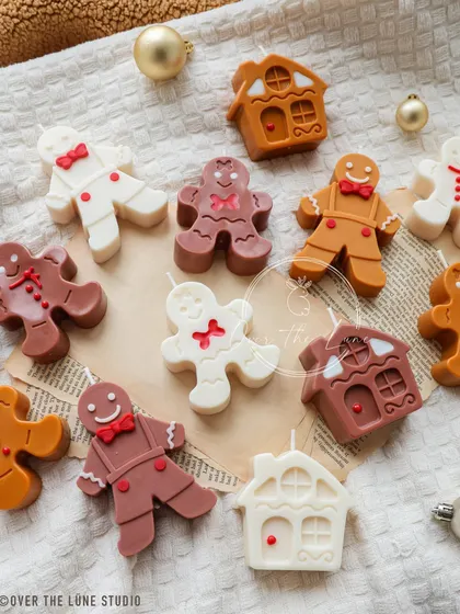 My gingerbread family of candles, scattered on a cozy blanket. I offer them in various shades of brown and white, each with unique, hand-painted details.