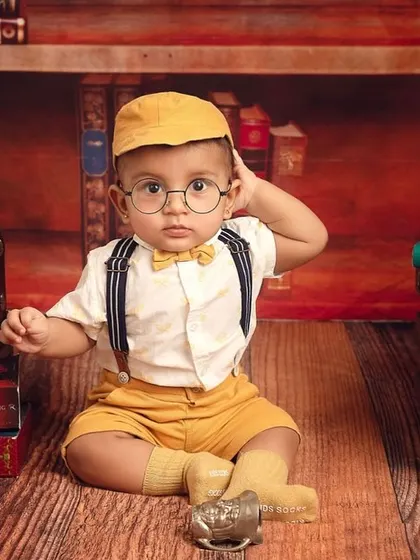 For the fans of magic, my 'Baby Potter' theme is a whimsical dream. With tiny glasses and a library of books, we can create a truly enchanting scene for your little wizard.