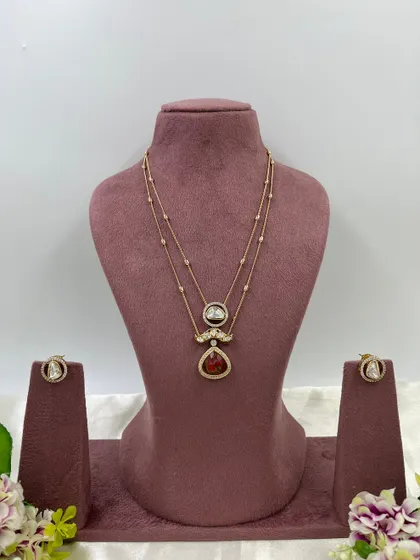 The Myra Crystal Bloom Necklace. This is another lightweight, double-chain design with crystal pendants, perfect for modern and minimalist tastes. Available in red and green.