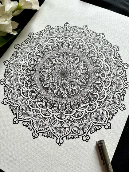There is a classic beauty in black and white. This intricate fineliner mandala highlights the pure, meditative power of line work, a fundamental skill we explore in all my art therapy sessions.