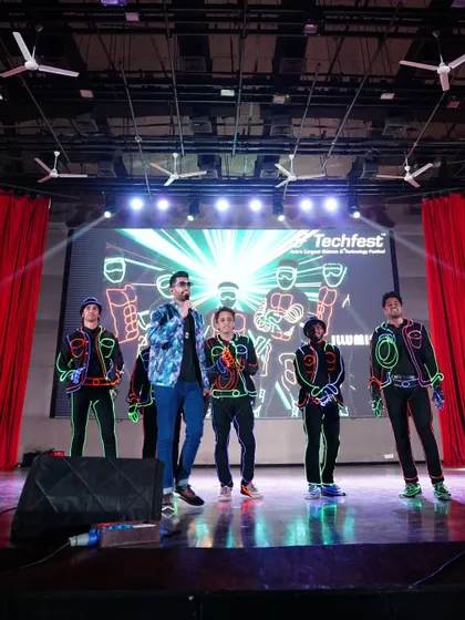 Sharing the stage with the talented performers of the Illuminati dance crew at Techfest. A host's job is also to make the artists shine.