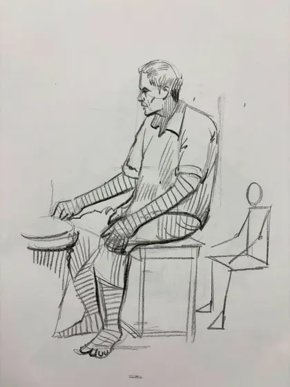 A seated figure sketch, including a small diagram to show the basic construction of the pose.