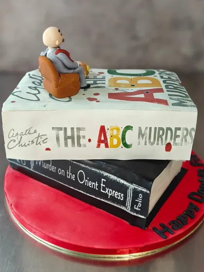 For the mystery lovers, this Agatha Christie cake was a thrilling challenge. We recreated the book covers of "The ABC Murders" and "Murder on the Orient Express" with a tiny Hercule Poirot on top. It’s proof that if you can dream it, we can bake it.