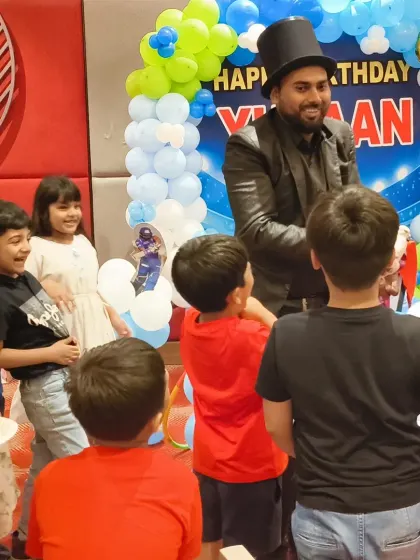 Entertainment is key to a successful party. I work with talented performers, like this magician who captivated the children at a cricket-themed birthday, ensuring that guests of all ages are engaged and have a wonderful time.