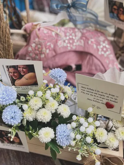 A close-up on the personalized details, including handwritten notes and photographs, that make a milestone gift truly unforgettable.