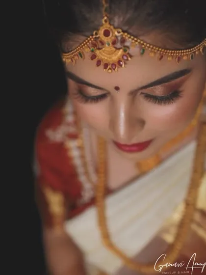 An artistic top-down shot showing the detail of the eye makeup and traditional matha patti. I used warm, earthy tones for a classic and elegant feel.
