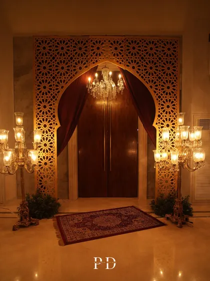 We transport your guests to another world from the moment they arrive. This grand entrance for a Sufi-themed Sangeet used intricate jaali work, rich velvets, and dramatic candelabras to set a tone of royal, mystical elegance.