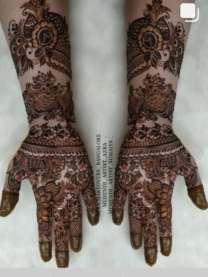 This elegant bridal design features peacock and floral motifs with delicate shading for a 3D effect.