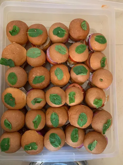 A box of fresh mini veggie burgers.