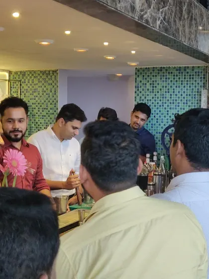 A candid moment from a cocktail session. It's all about creating a welcoming space where people can learn, ask questions, and share a laugh.