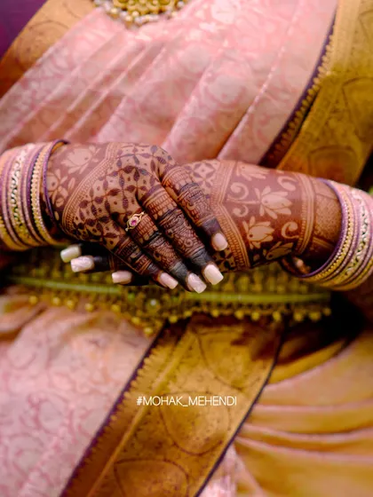 A detailed close-up of the mehndi stain, showing how the color has developed into a deep, rich shade. The intricate floral and geometric patterns are beautifully defined.
