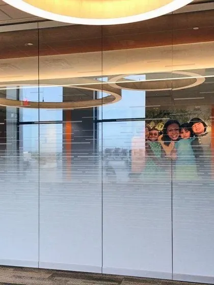 This gradient frosted film transitions from fully opaque at the bottom to clear at the top. It's a sophisticated solution for office partitions, offering privacy where needed most.