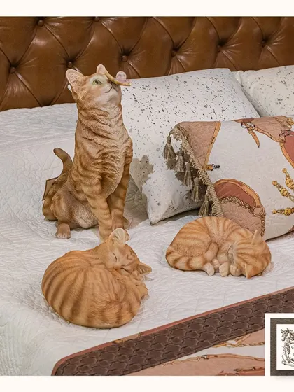 For the cat lovers, I've found these delightful orange tabby cat figurines. Captured in playful and sleeping poses, they add a touch of whimsy and charm to a bedroom or living space.