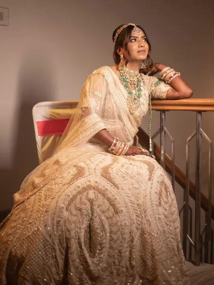 Aanchal looking like modern royalty. Her glamorous makeup and elegant pose highlight the sophisticated and regal bridal style we aimed for.