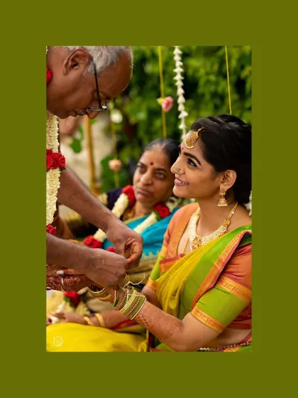 A precious moment from the Varapooje ceremony. The makeup was designed to look soft and beautiful from every angle, even in candid moments like this one.