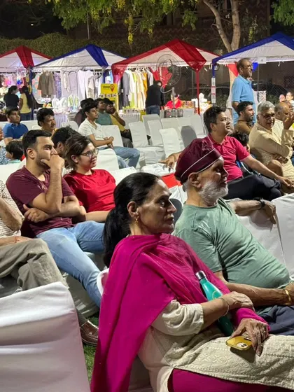 An engaged audience watching a performance at our outdoor festival in Heritage City, Gurgaon. We arrange for comfortable seating and a great view of the stage for all guests.