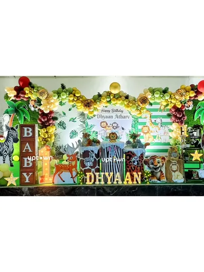 A vibrant jungle theme with a green and yellow color palette and lots of animal friends.