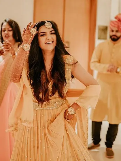 The bride owns the dance floor, with a guest capturing the moment on their phone. We love seeing and documenting this infectious energy.