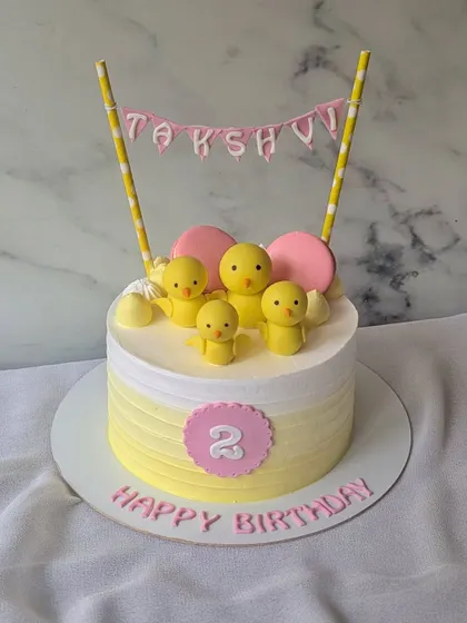 This cutie is quacking into a birthday celebration! A simple and sweet cake with a family of yellow ducks for a 2nd birthday.