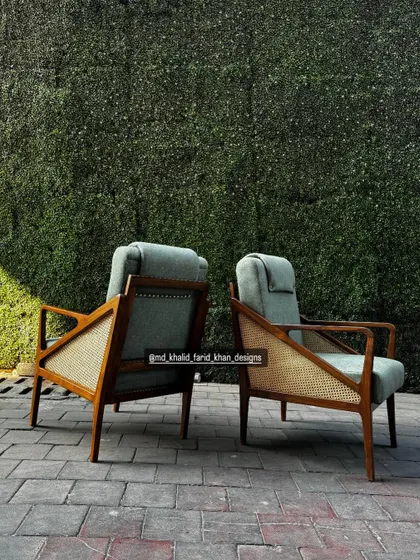 A rear three-quarter view, showing the detail on the back of the chair.